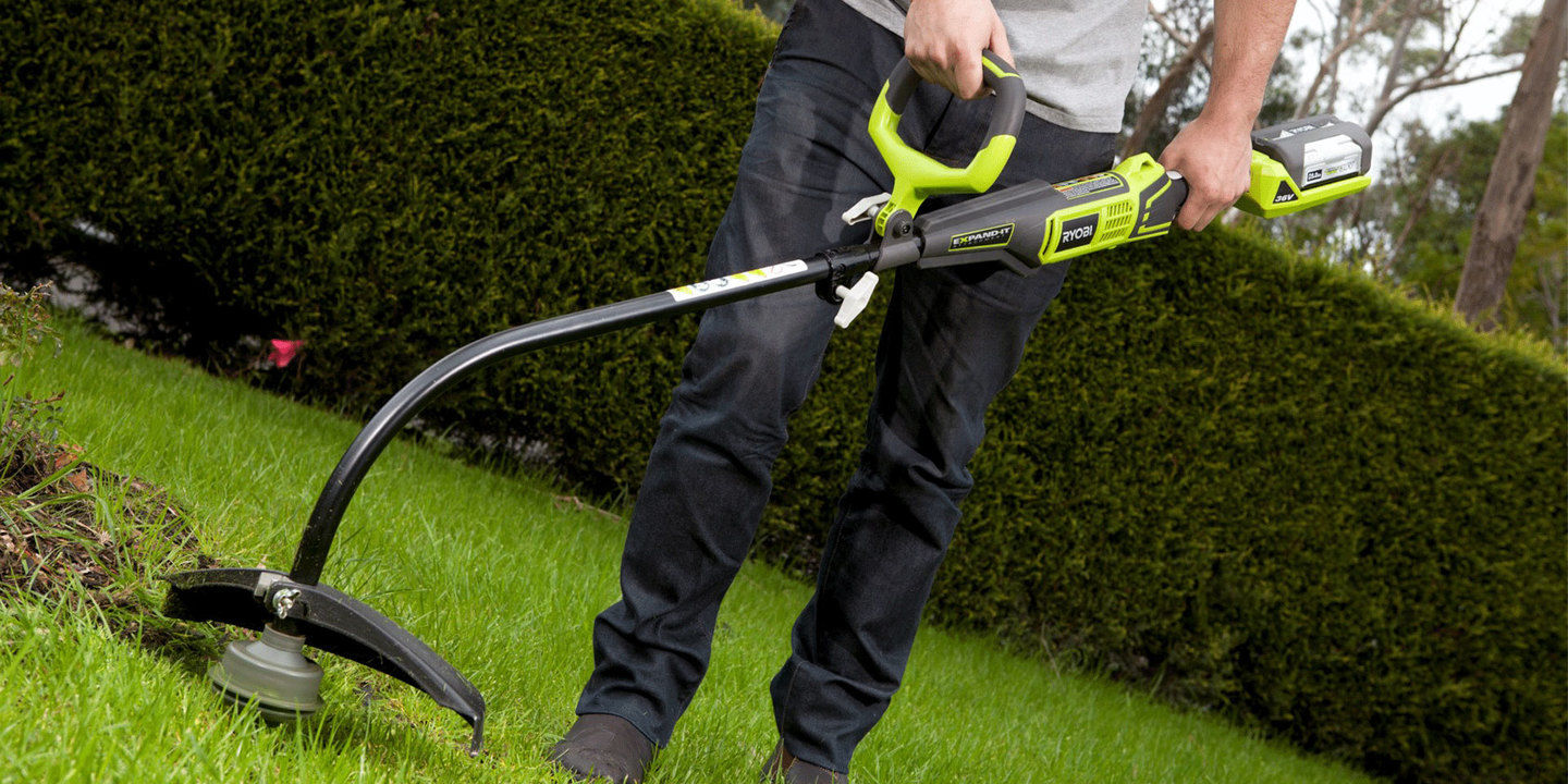 A Ryobi line trimmer with a curved shaft