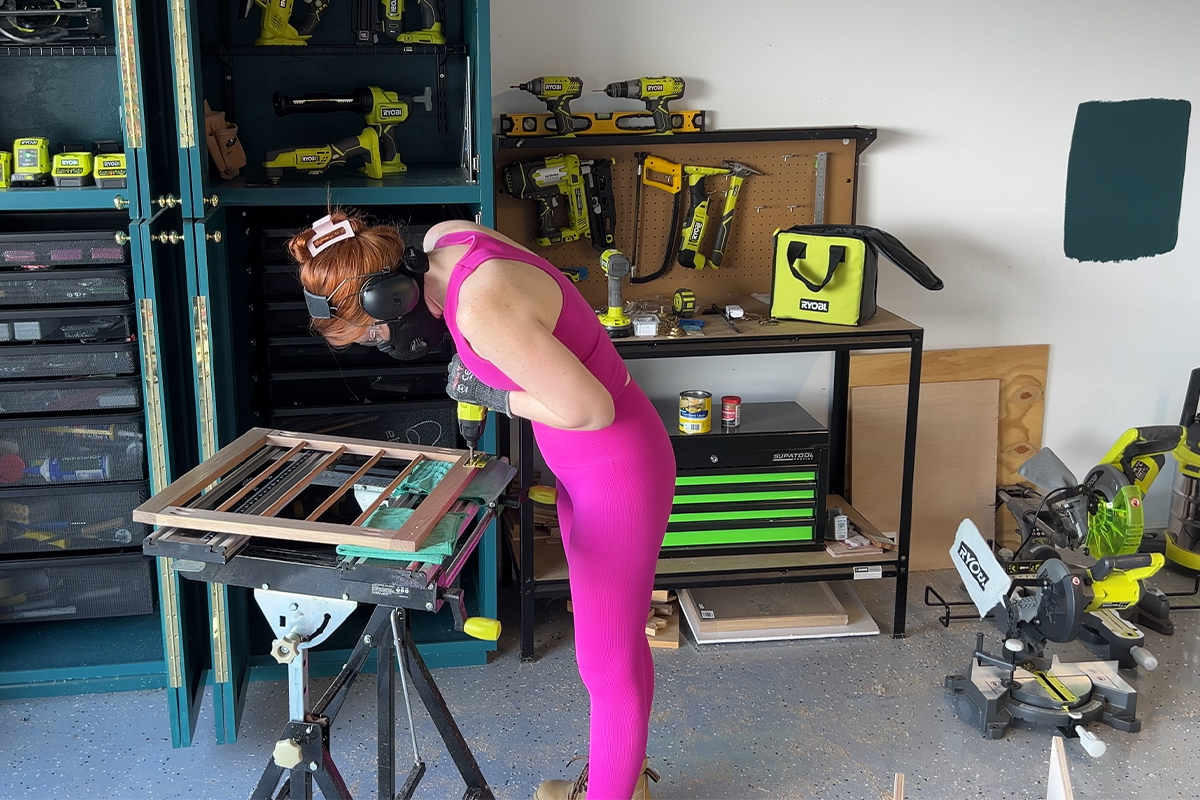 Emma assembling the DIY Clothes Rack using a RYOBI Impact Driver